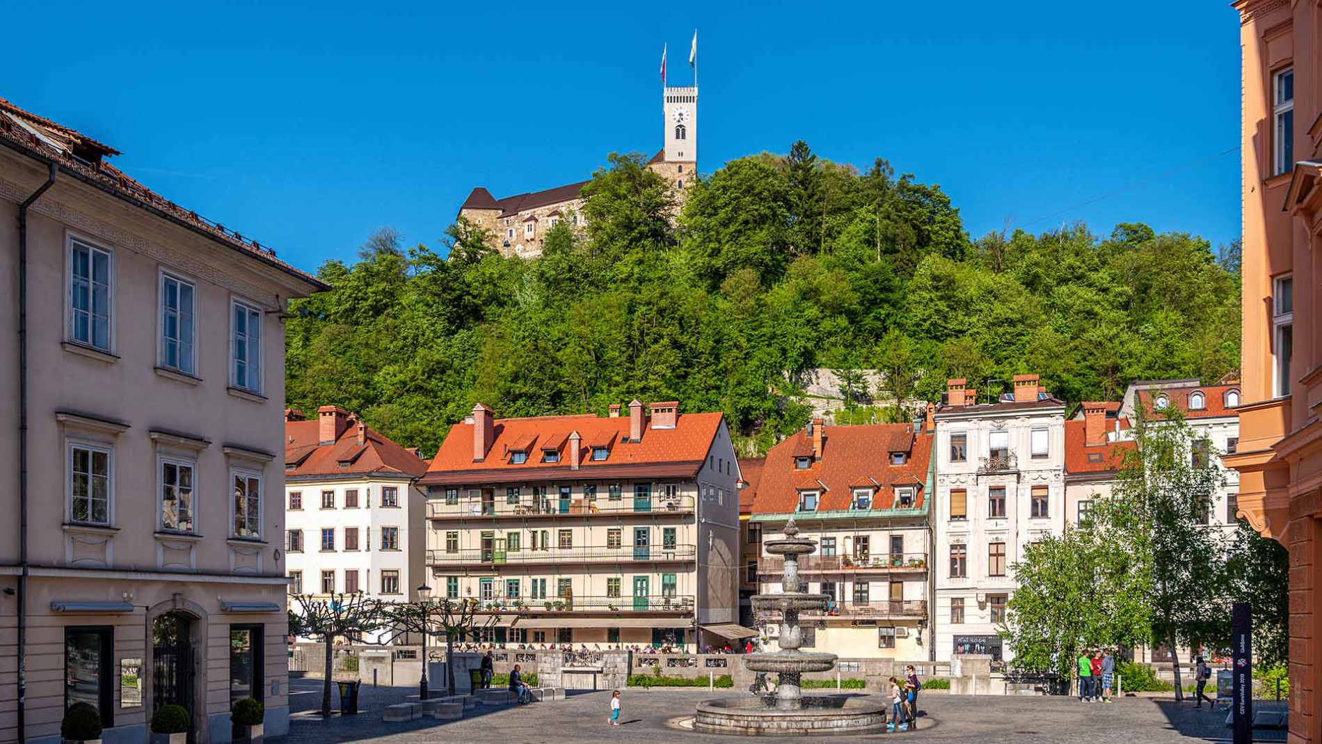 Novi trg Square in the background Ljubljana Castle.