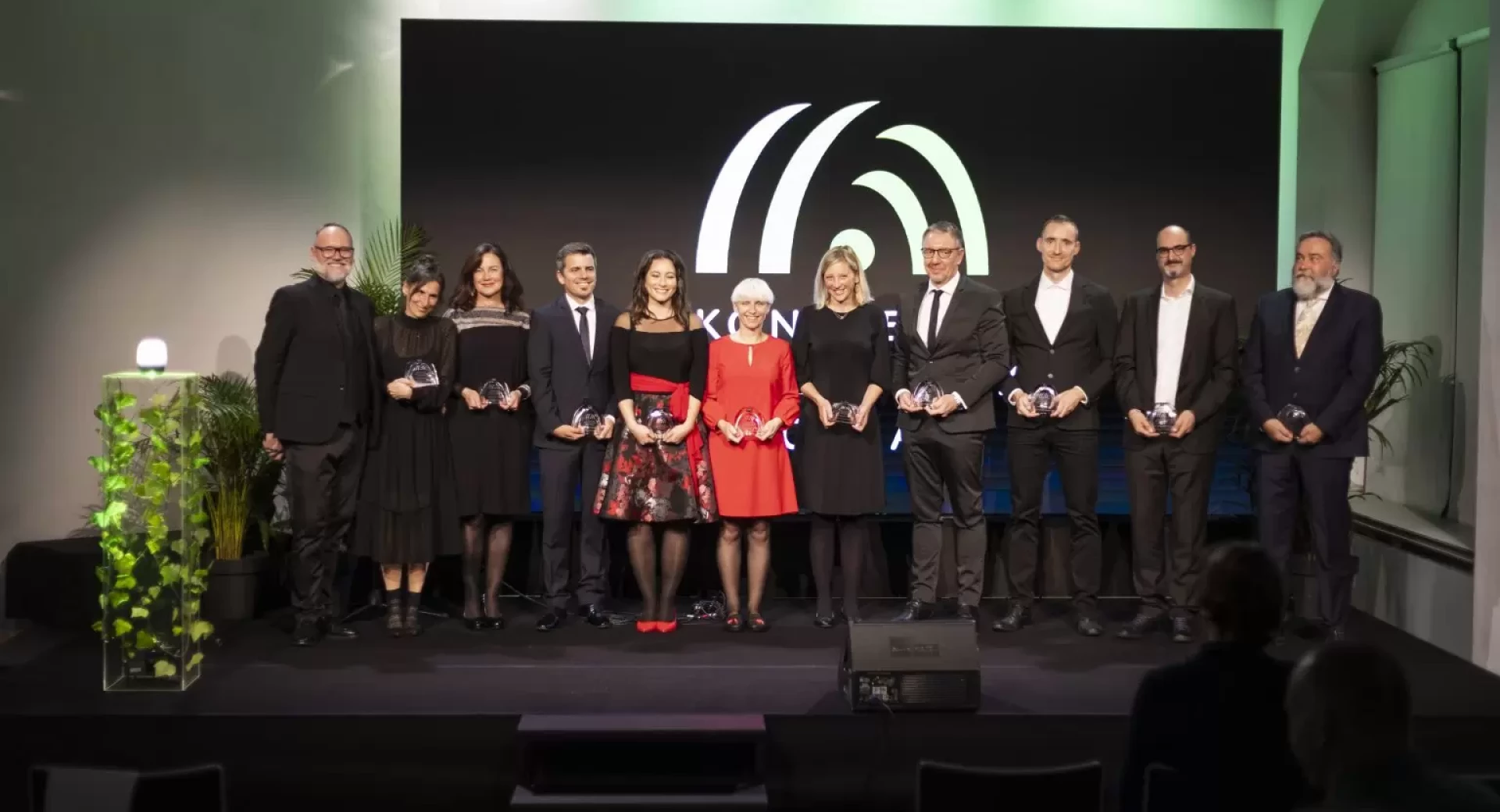 peope with awards standing on stage