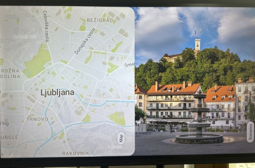 Zaslon z zemljevidom in fotografijo Ljubljane