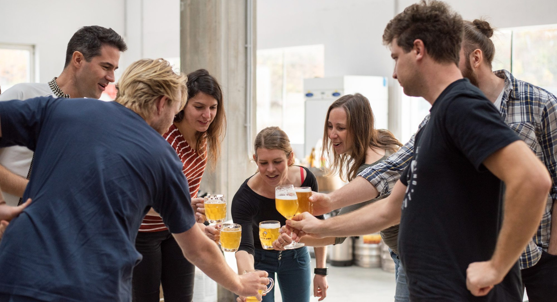 People toast with beer.