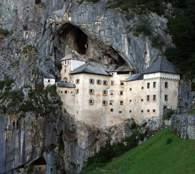 A castle embedded in a rock wall.