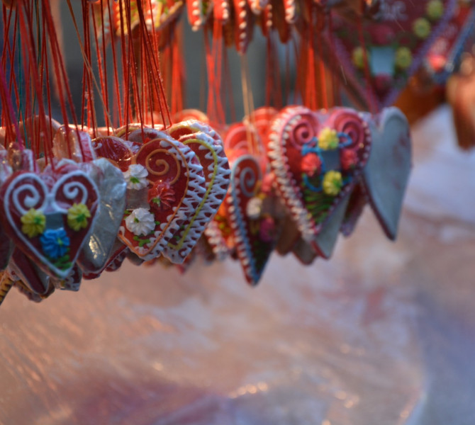 Gingerbread hearts hanging on strings.