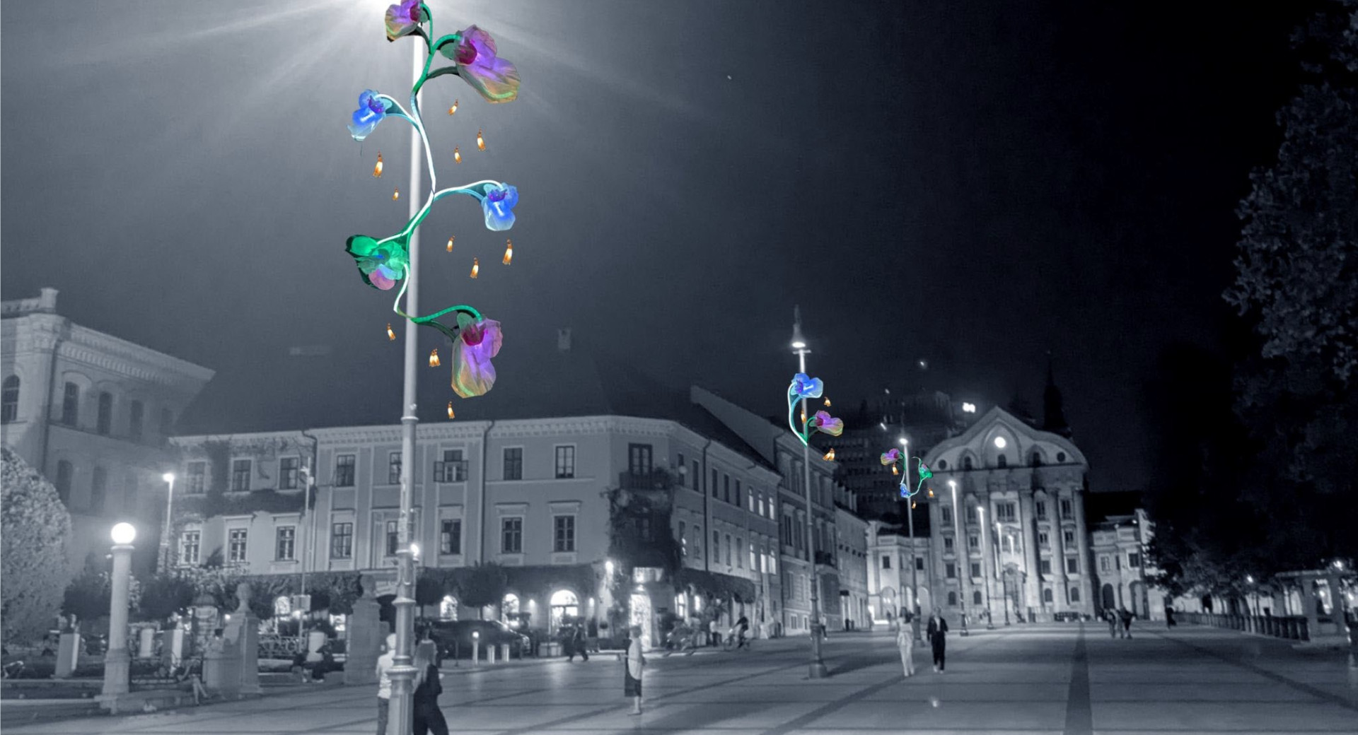 A natural translation would be:  **“A black-and-white photograph of the city centre with brightly decorated, colourful street lamps.