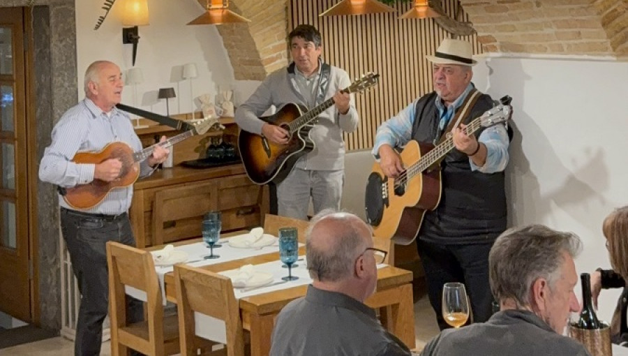 A group of musicians in a brick wall room.