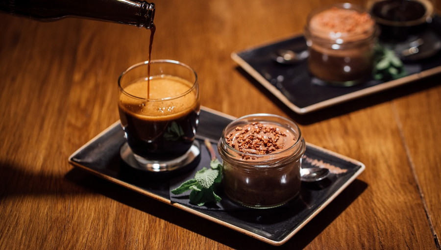 Serving try with a glass of beer and chocolate.