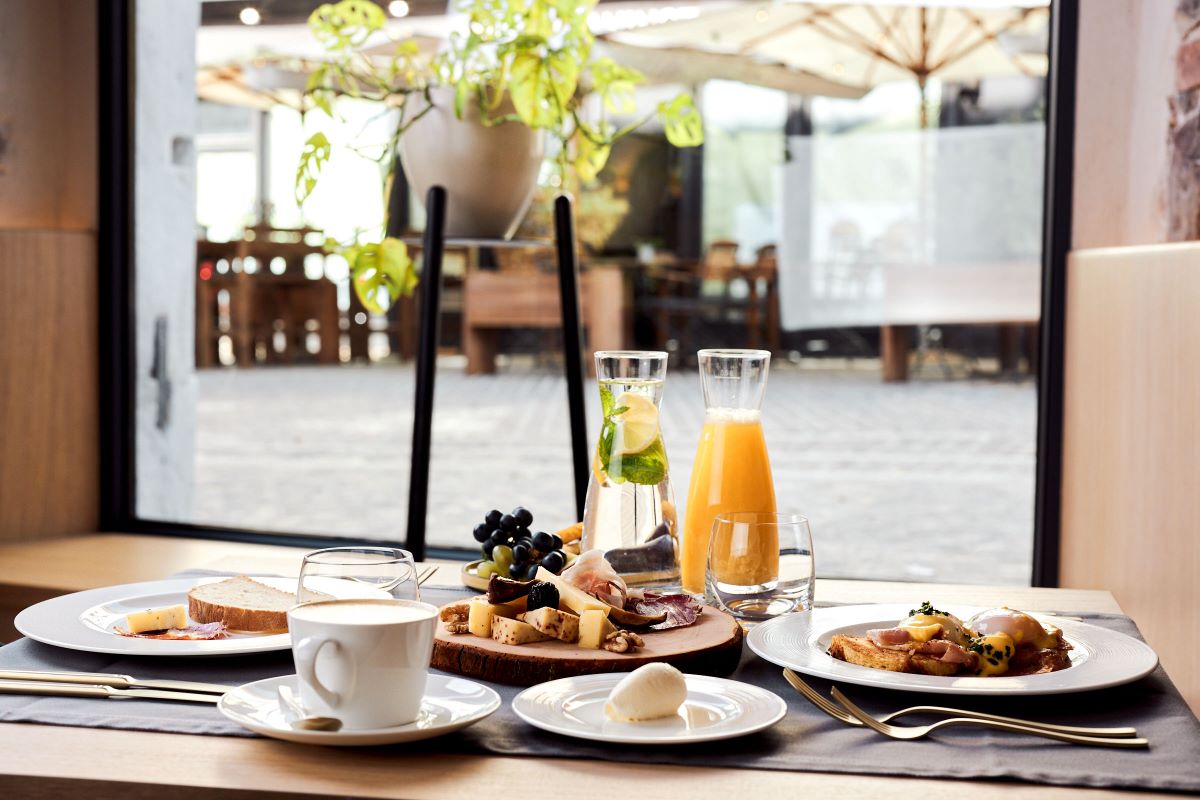 A delightful breakfast spread with fresh juice and gourmet selections.