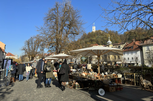 Stalls with antiques at the Sunday Flea Market on Breg street in Ljubljana.