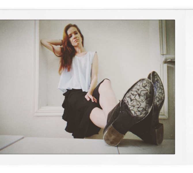 A woman sitting on the floor.