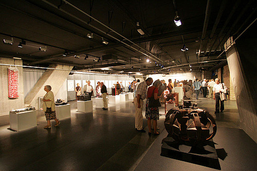 Visitors of the exhibition inside the gallery.