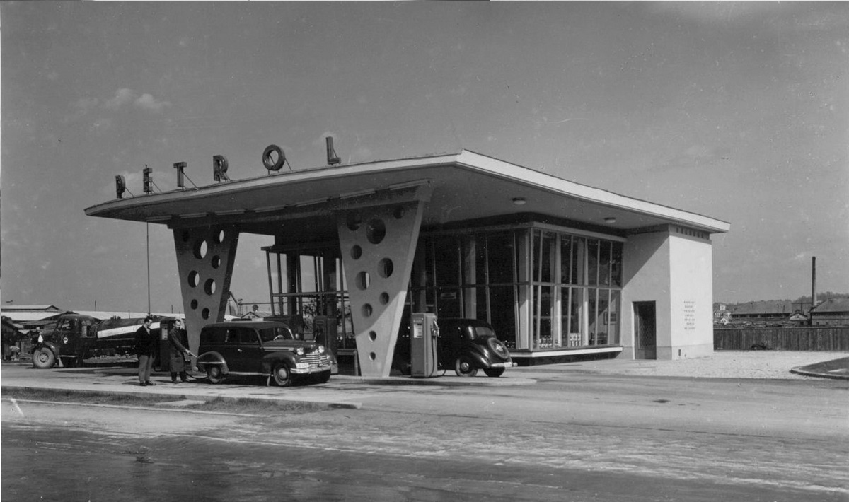 Black-and-white photograph of an old petrol station.