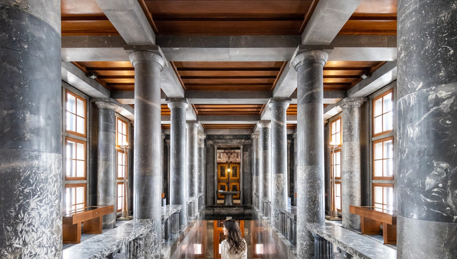 The interior of a large hall with marble columns.