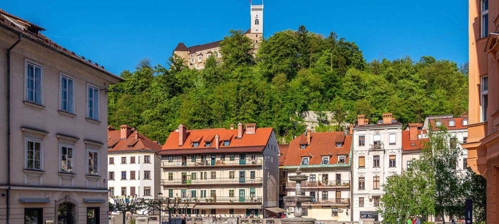 Novi trg Square in the background Ljubljana Castle.