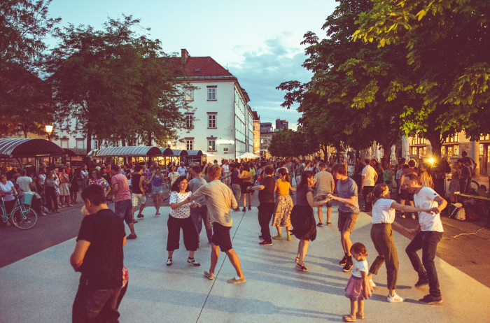 People dancing on the street.