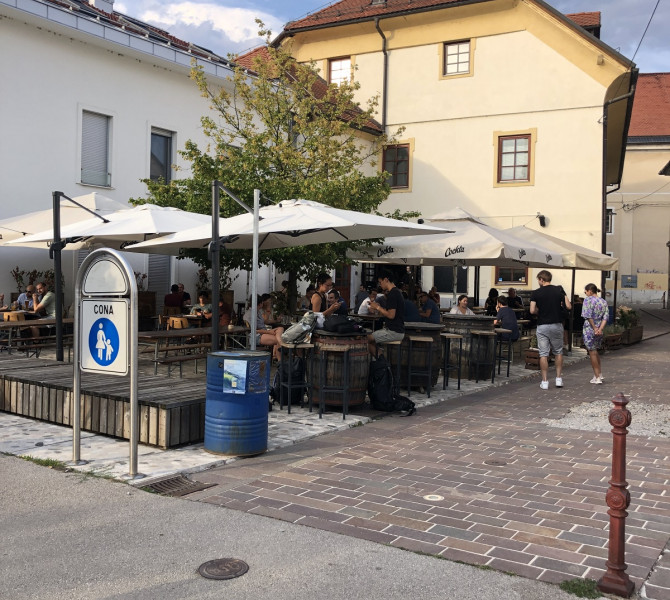 A bar with barrels as tables.