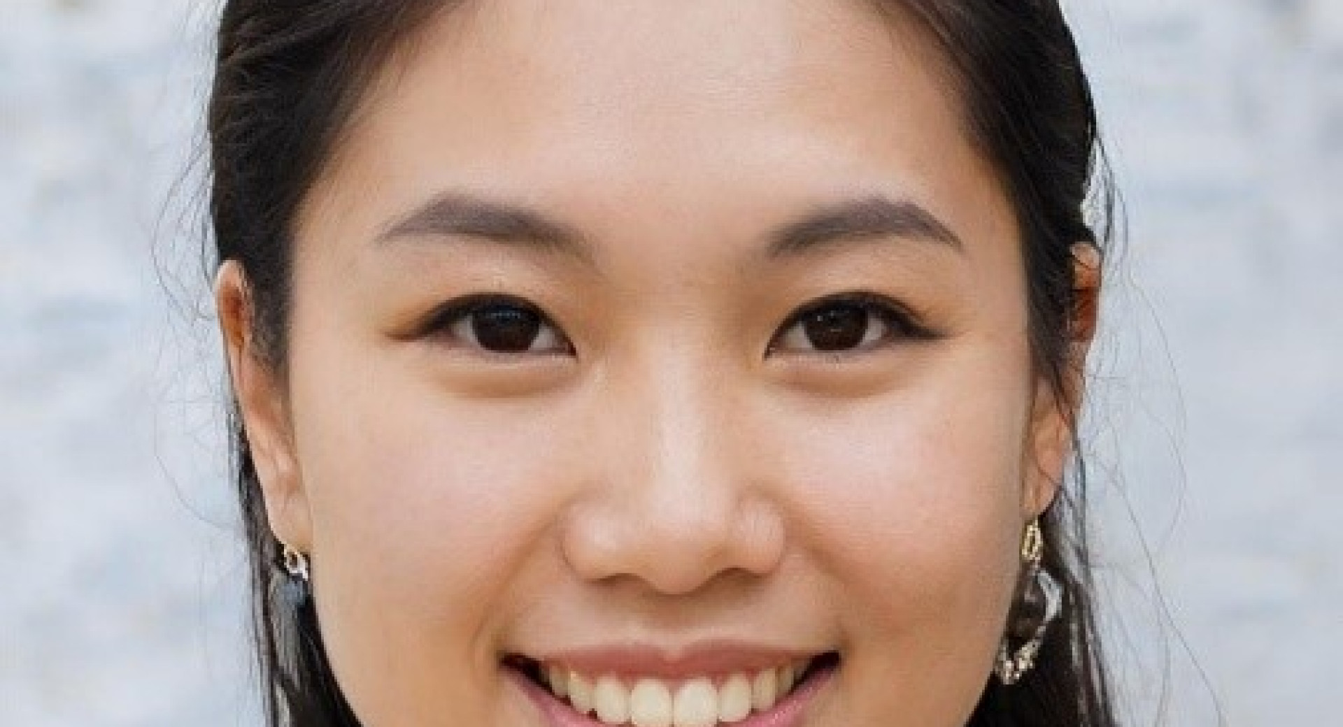 A young Asian woman with dark hair and eyes.