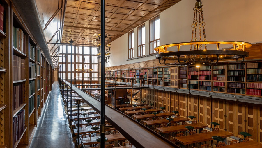 A large old library made of wood and steel.