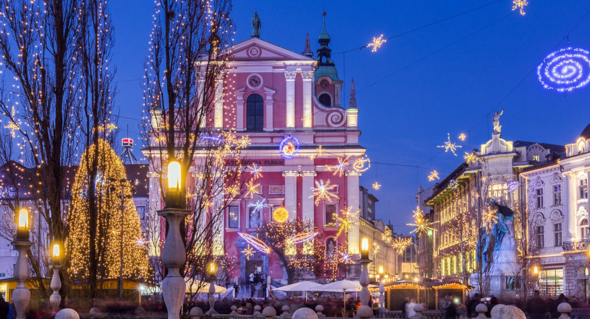 A city illuminated with festive lights.