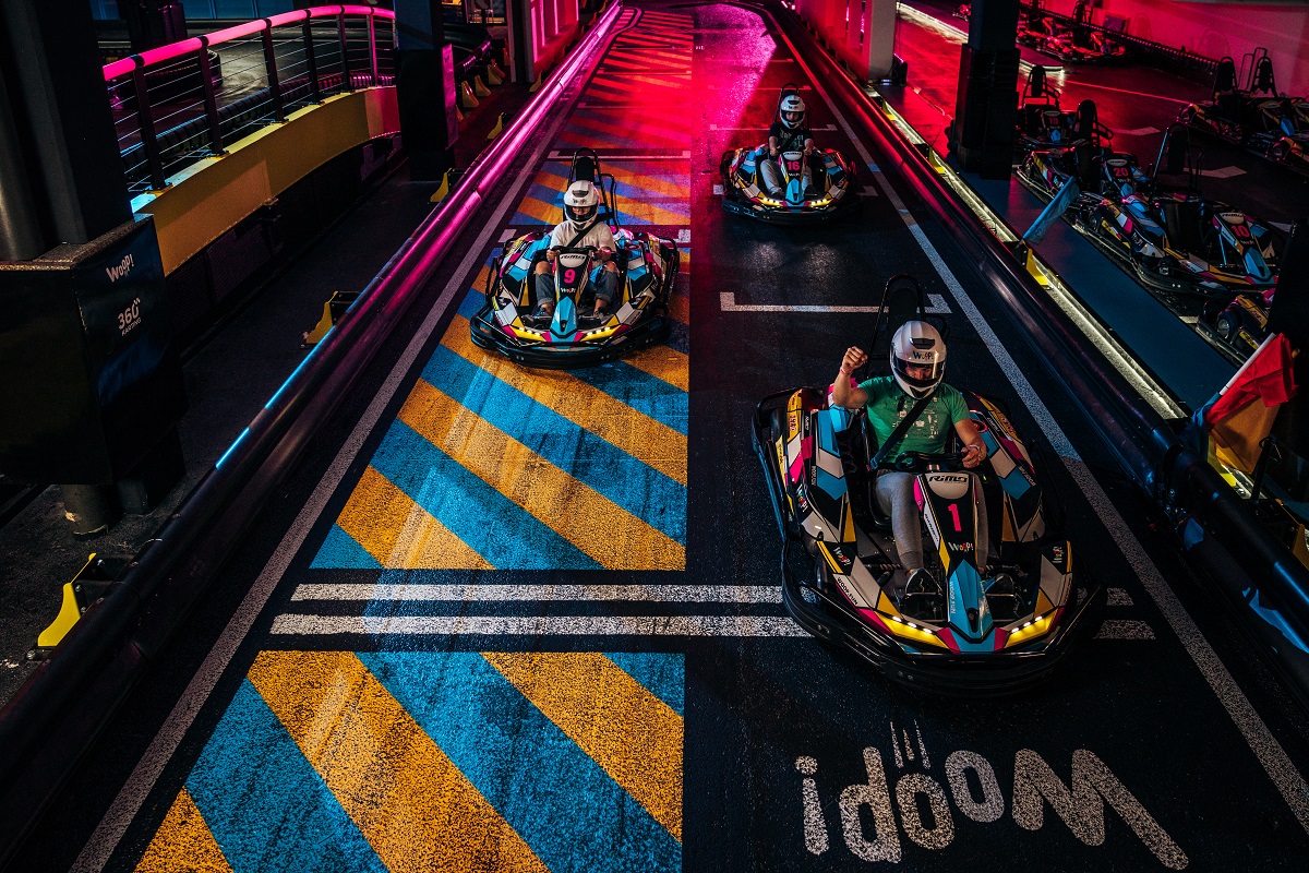 Go-carts racing on a track.