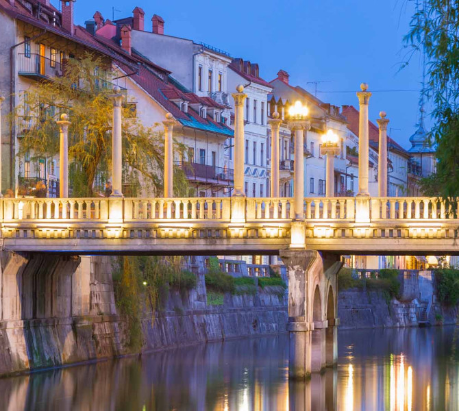 Cobblers' Bridge in the glow of evening lights.