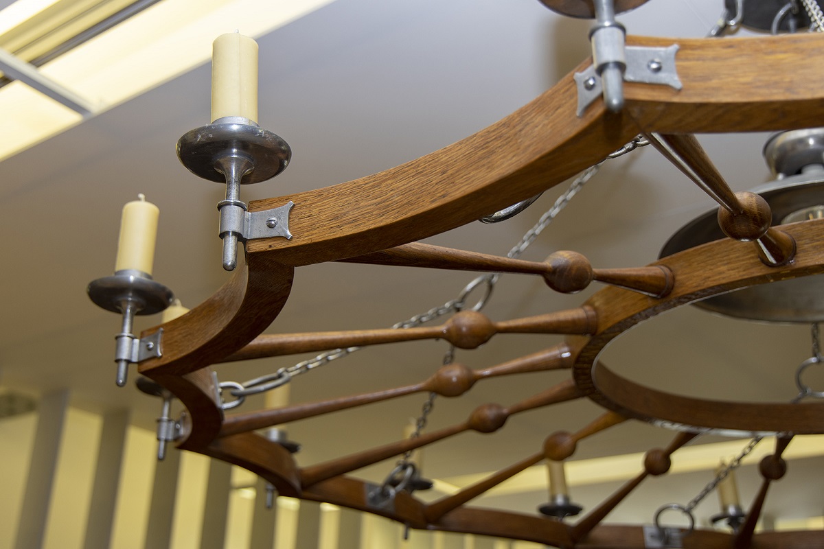 Wooden chandelier with candles.