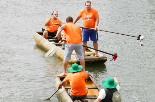 People paddling in boats.