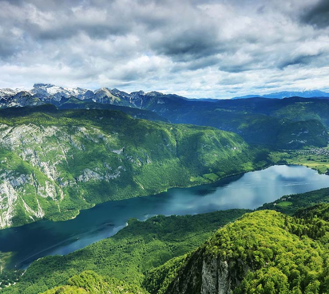 Lake Bohinj surrouded with mountains.