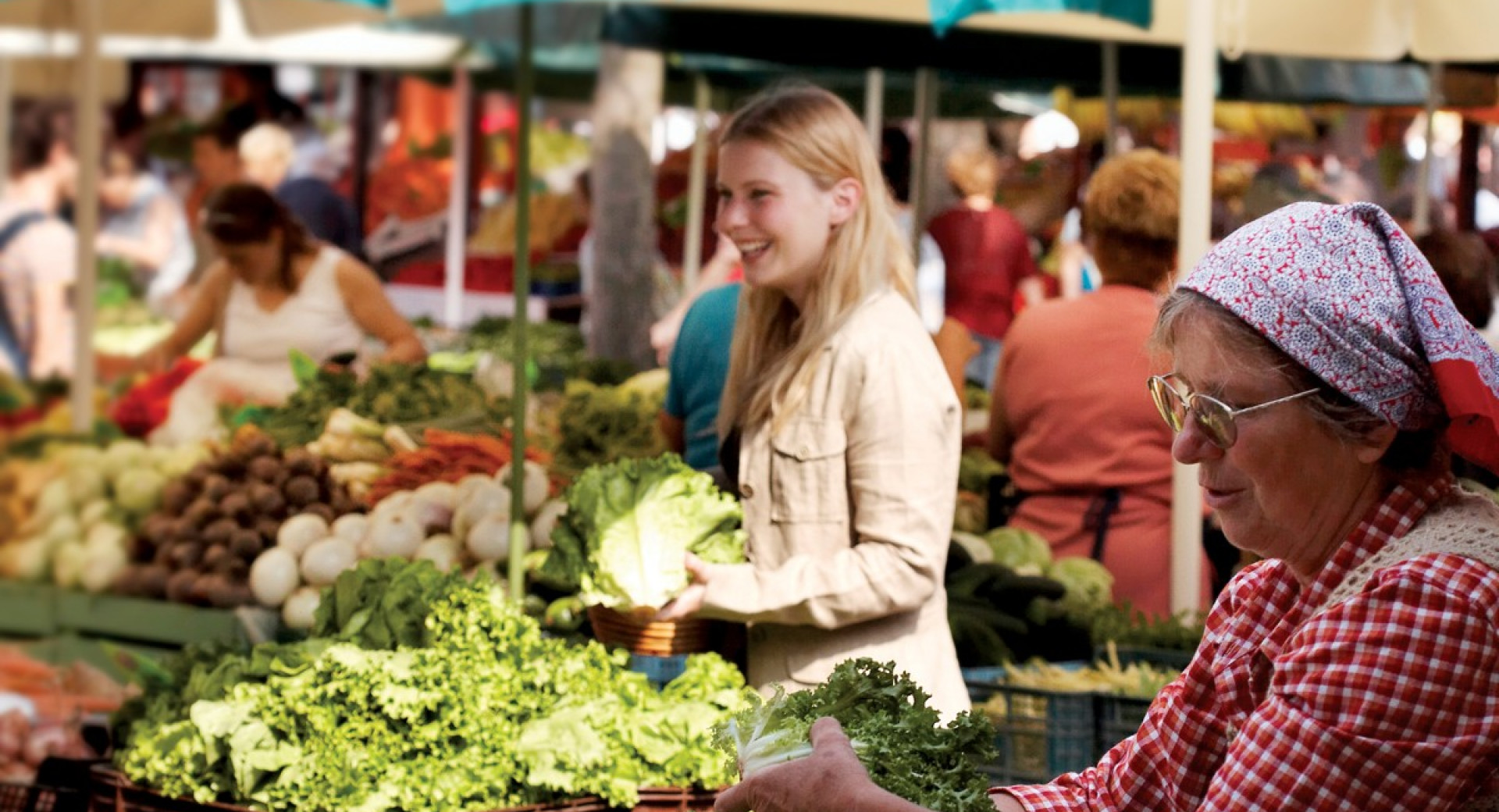 Vendors and visitors at the market.