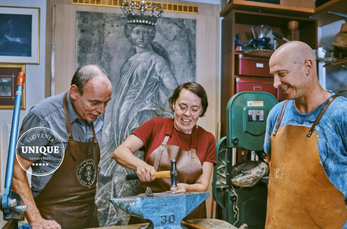 Shaping a plate at a goldsmithing workshop.