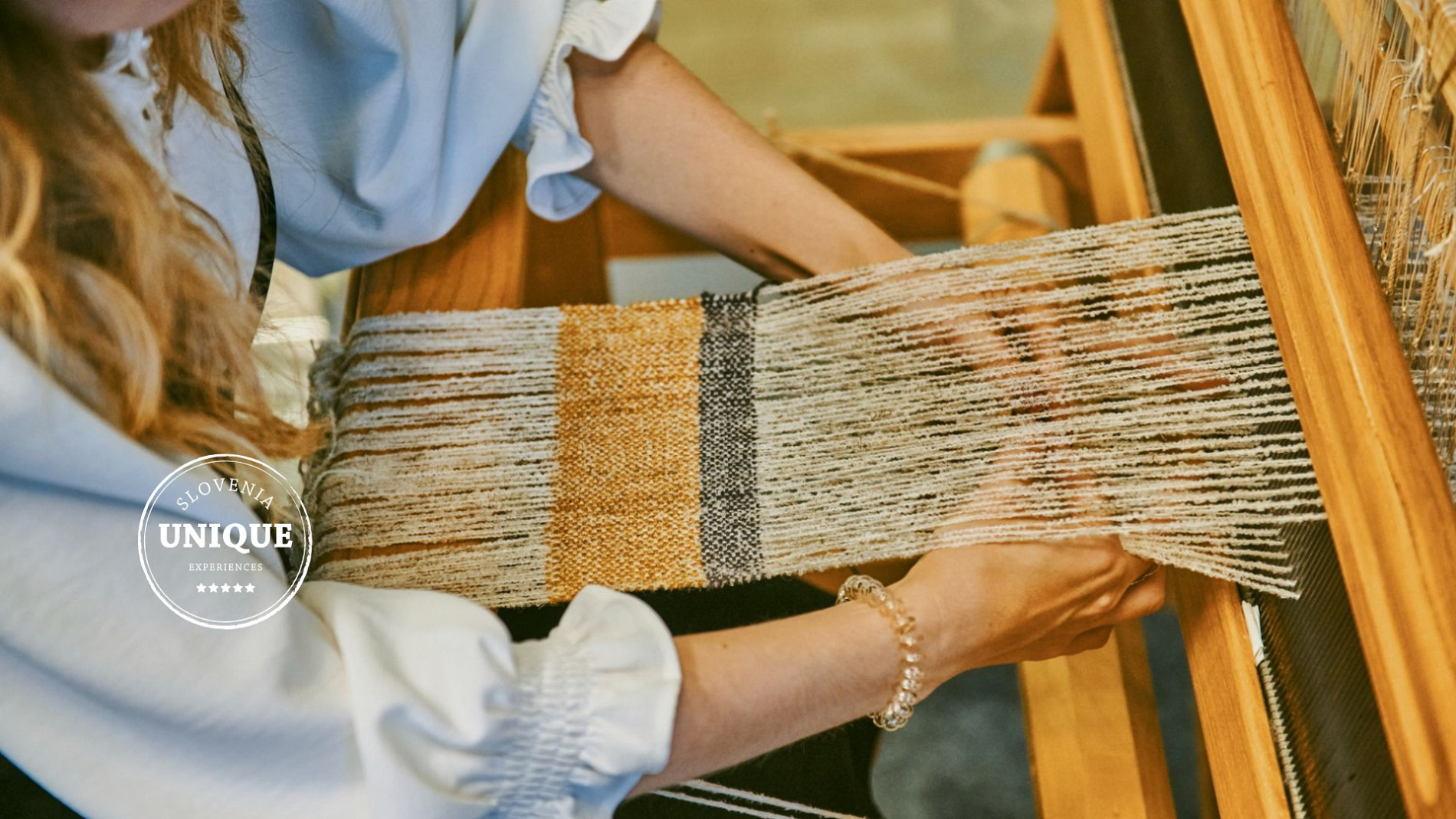 Weaving on a loom as part of a craft workshop.